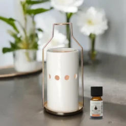 Brûle-parfum et huile essentielle dos